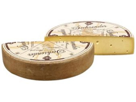 KI generiert: Ein runder Käse, halbiert, mit der Aufschrift "Sechsender" und "Goldengel".