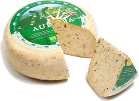 KI generiert: Ein runder Käse mit einem Stück herausgeschnitten. Text: "Aurora Gold".