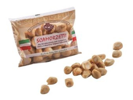 KI generiert: Das Bild zeigt ein Stück Blauschimmelkäse. Der Käse hat eine helle Farbe mit blauen Adern.