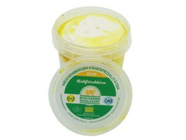 KI generiert: Ein Behälter mit Weserbergland Käsespezialitäten "Kuhfrischkäse".