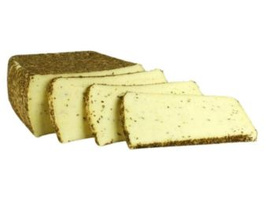 KI generiert: Einige Scheiben Kümmelkäse auf einem Laib.
