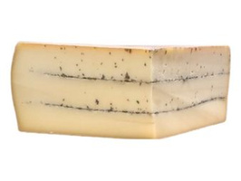 KI generiert: Ein Block Käse mit Kräutern und einem blauen Etikett.