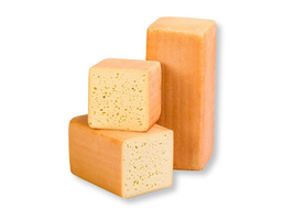 KI generiert: Das Bild zeigt ein großes Käsestück mit einem herausgeschnittenen Teil, wodurch die gelbliche Innenstruktur sichtbar wird. Der Hauptinhalt des Bildes ist der Käse.