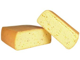 KI generiert: Ein runder, angeschnittener Schimmelkäse mit weicher, cremiger Textur.