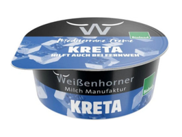 KI generiert: Das Bild zeigt ein Stück Blauschimmelkäse. Der Käse hat eine helle Farbe mit blauen Adern.