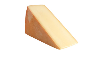 KI generiert: Ein Stück Hartkäse mit brauner Rinde und heller Oberfläche.