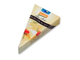 KI generiert: Das Bild zeigt ein Glas mit einem Lebensmittelprodukt namens "Wilde Weidekuh Carlo" in der Geschmacksrichtung "Curry & Dattel". Auf dem Etikett des Glases ist eine stilisierte Kuh abgebildet.