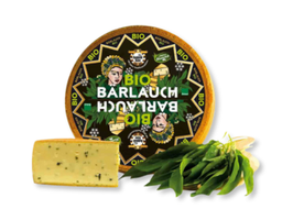 KI generiert: Auf dem Bild sind zwei Käselaibe abgebildet, einer ganz und der andere aufgeschnitten. Beide tragen ein Etikett mit der Aufschrift "Gouda".